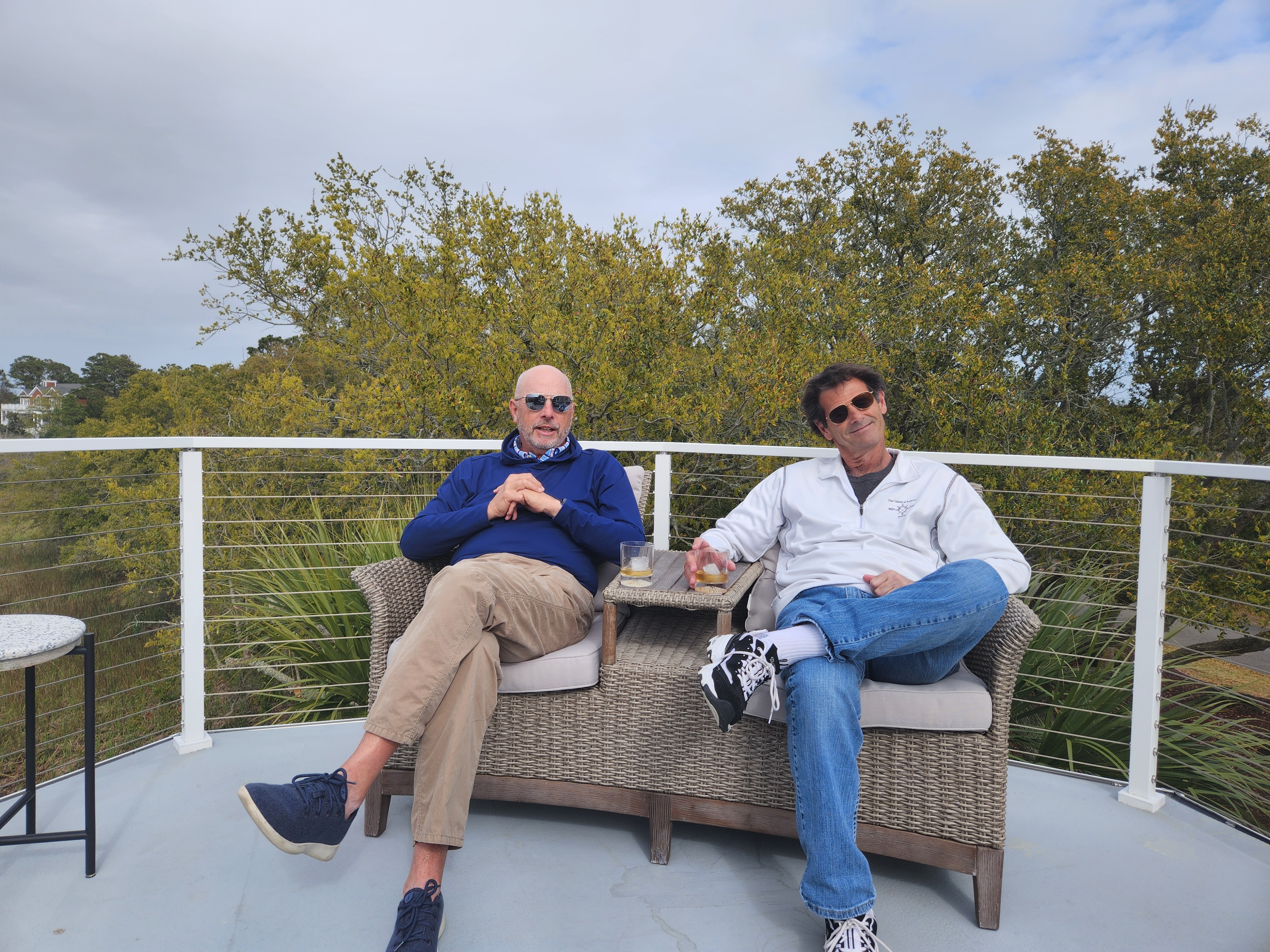 Two Wild Dunes club officers relaxing on the deck